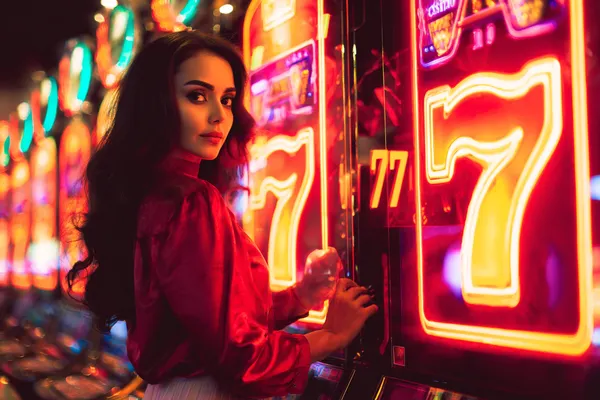 A young woman relaxing with her phone while dynamic casino elements float around her, illustrating the smooth mobile experience offered by the K677 app.