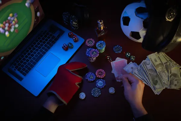 A glowing roulette wheel with cascading chips, symbolizing the engaging live and instant-win games available on K677.